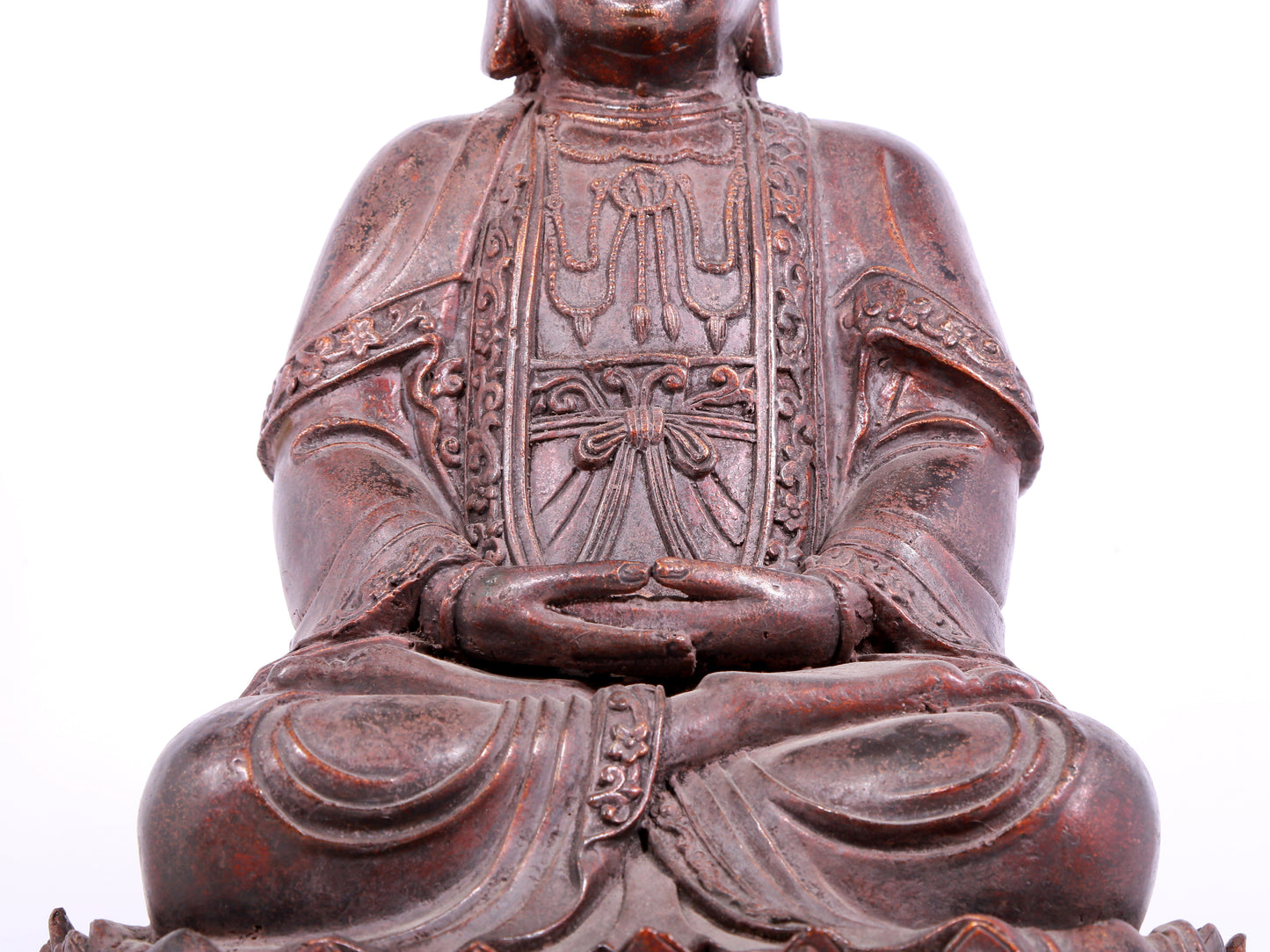 A solemn bronze Guanyin statue