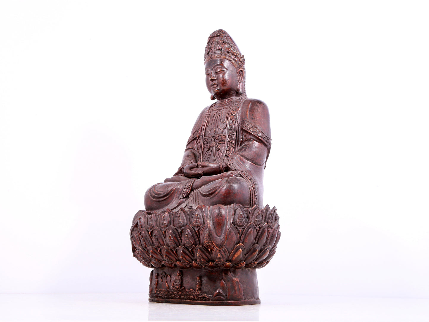 A solemn bronze Guanyin statue