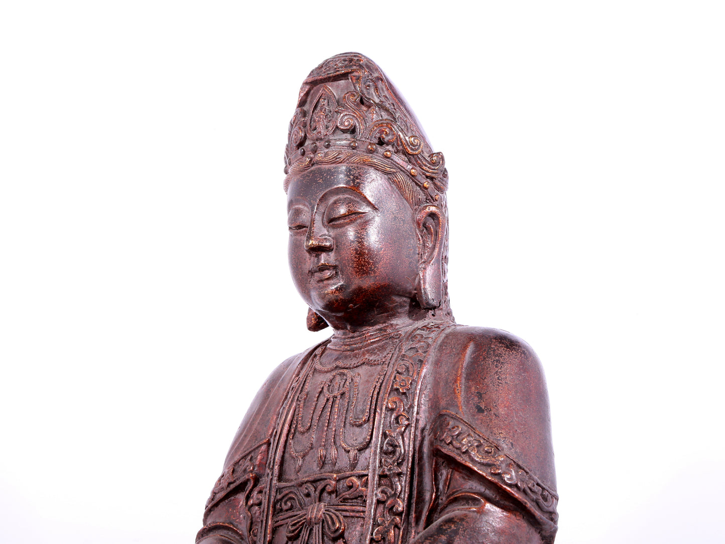 A solemn bronze Guanyin statue