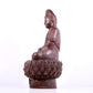 A solemn bronze Guanyin statue