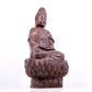 A solemn bronze Guanyin statue