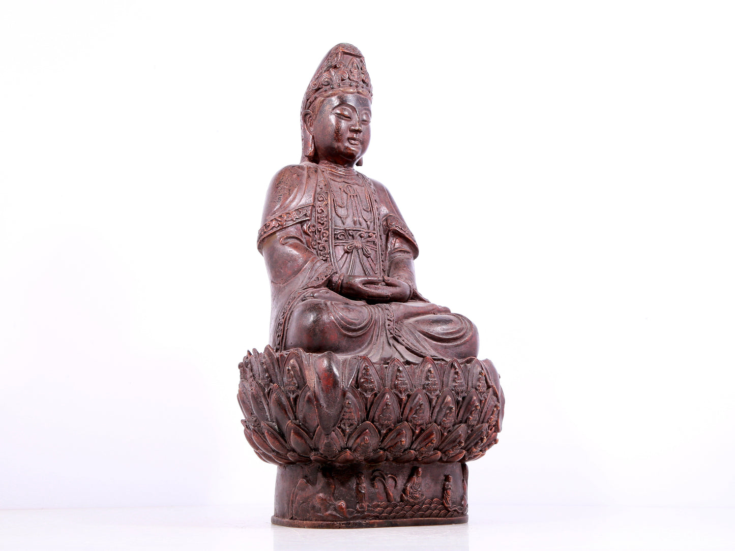 A solemn bronze Guanyin statue