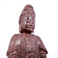 A solemn bronze Guanyin statue