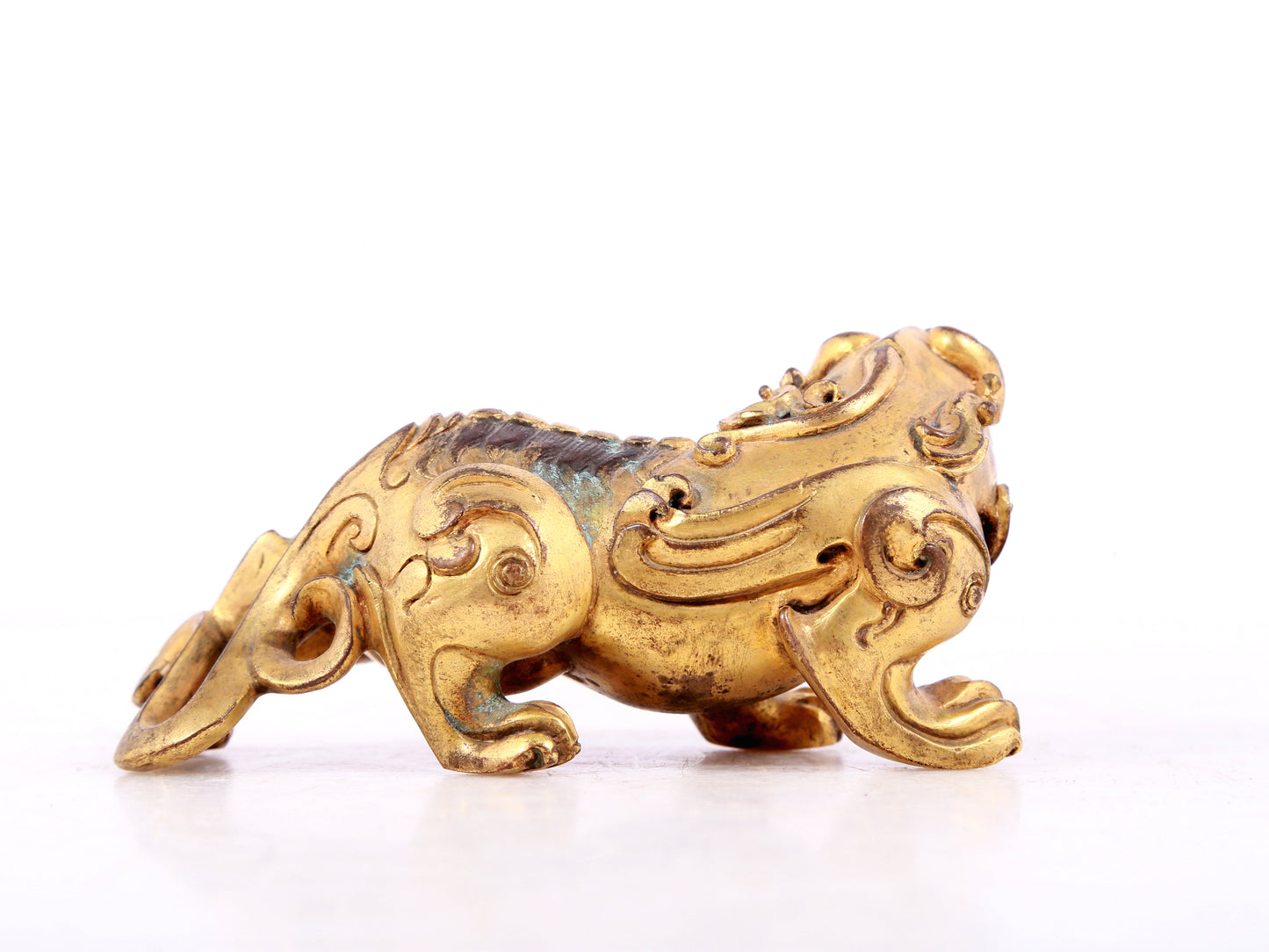 An exquisite gilt copper auspicious animal ornament