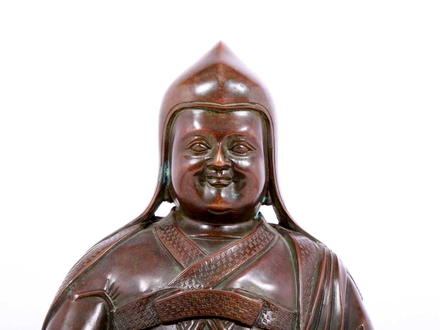 A solemn bronze statue of Tsongkhapa