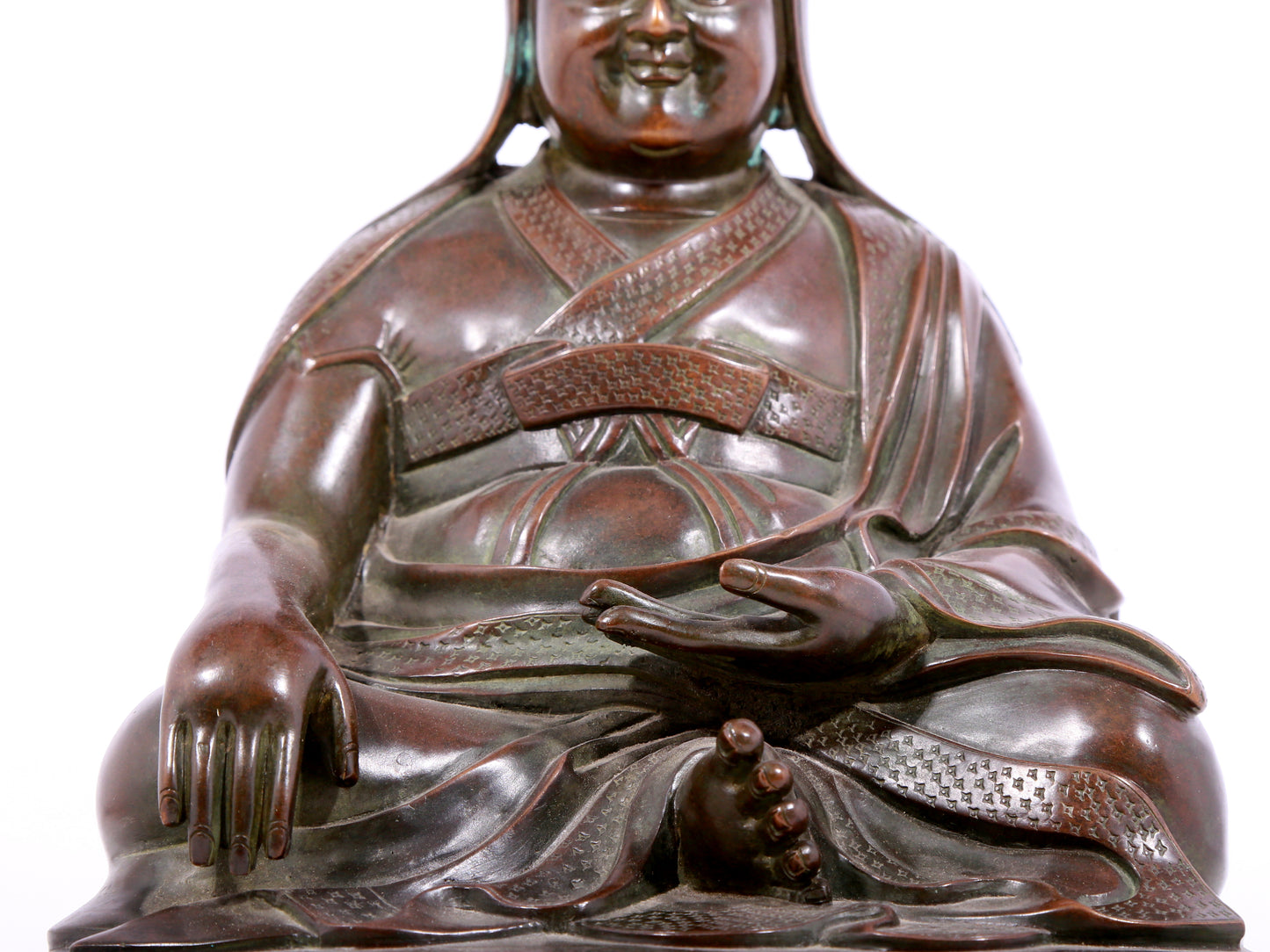 A solemn bronze statue of Tsongkhapa