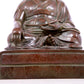 A solemn bronze statue of Tsongkhapa