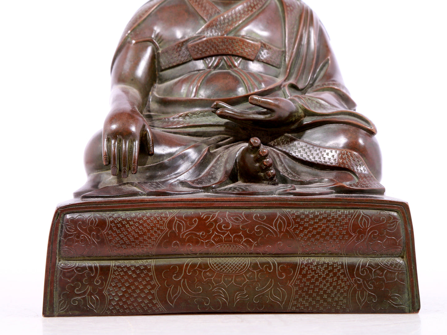 A solemn bronze statue of Tsongkhapa