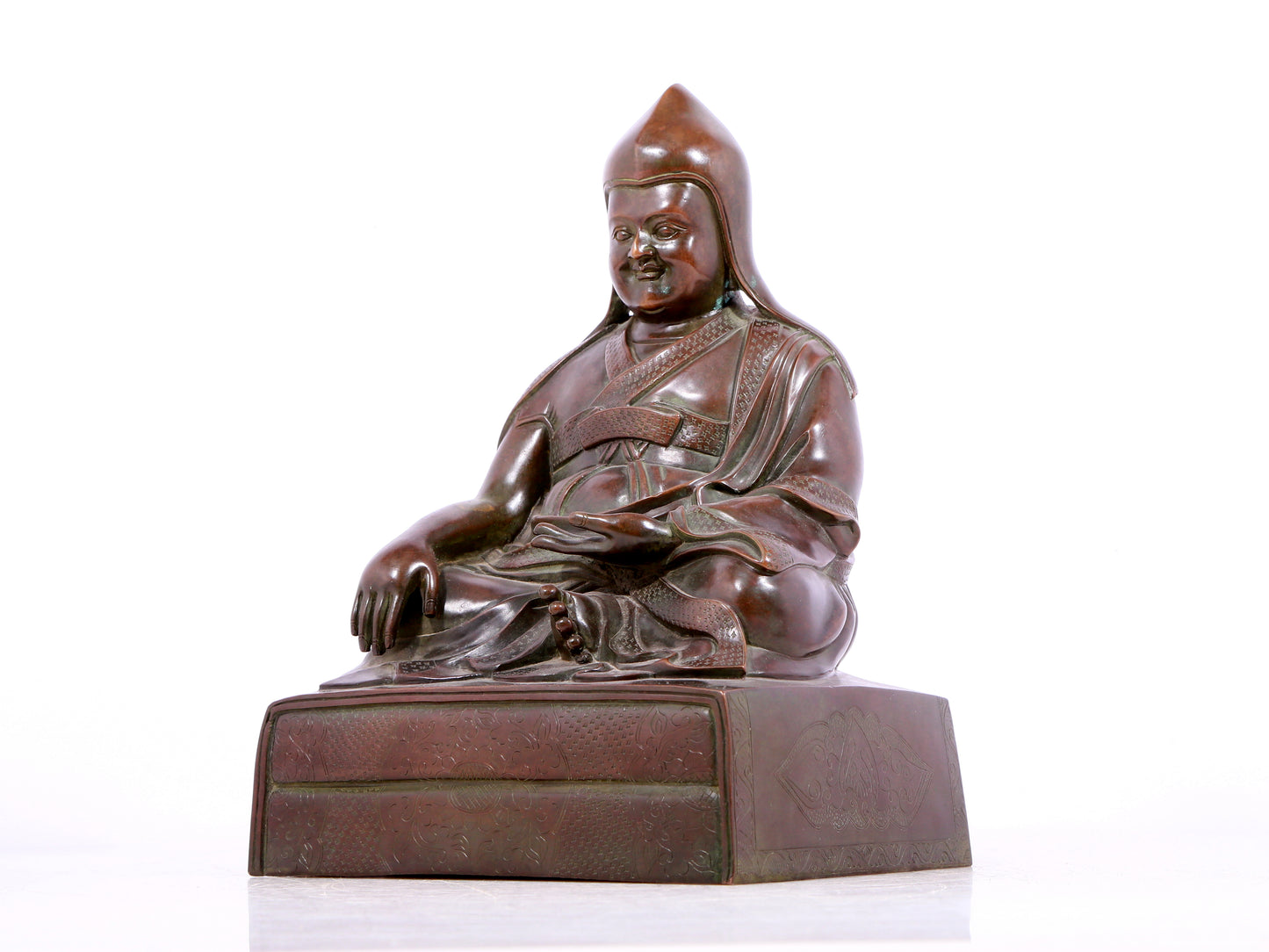 A solemn bronze statue of Tsongkhapa