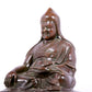 A solemn bronze statue of Tsongkhapa