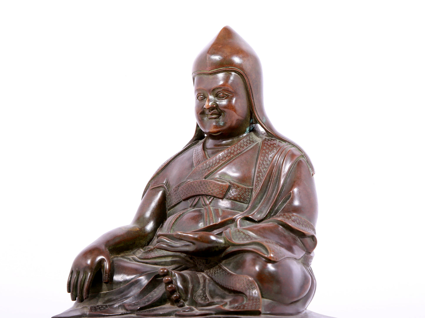 A solemn bronze statue of Tsongkhapa