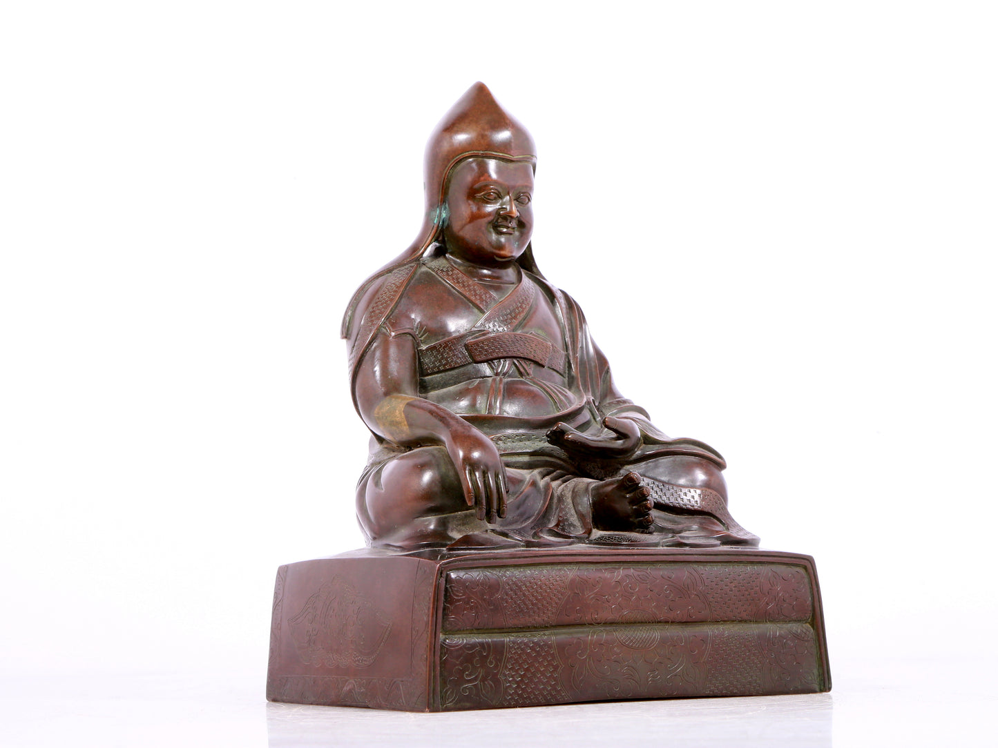 A solemn bronze statue of Tsongkhapa