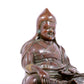 A solemn bronze statue of Tsongkhapa