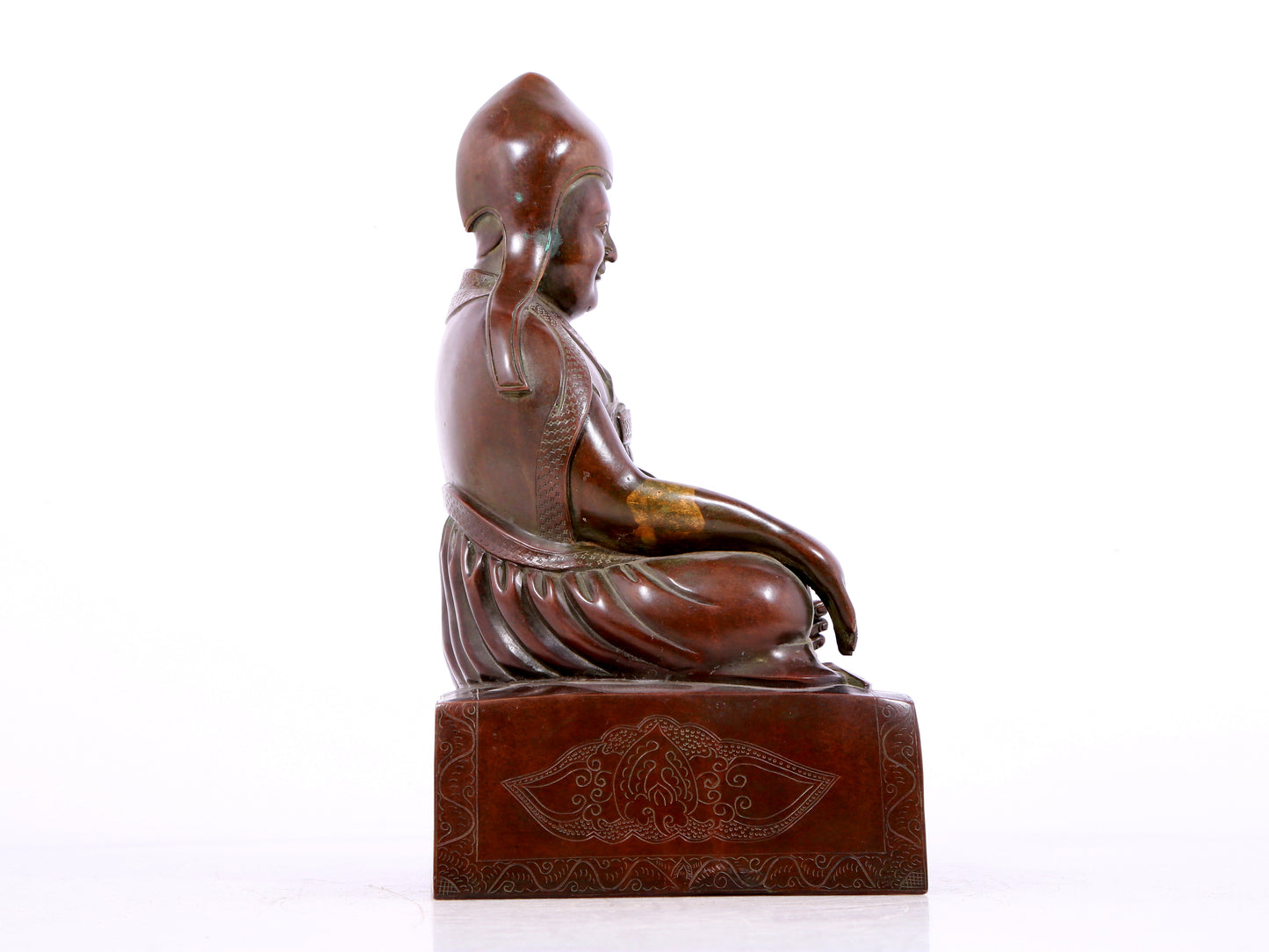 A solemn bronze statue of Tsongkhapa