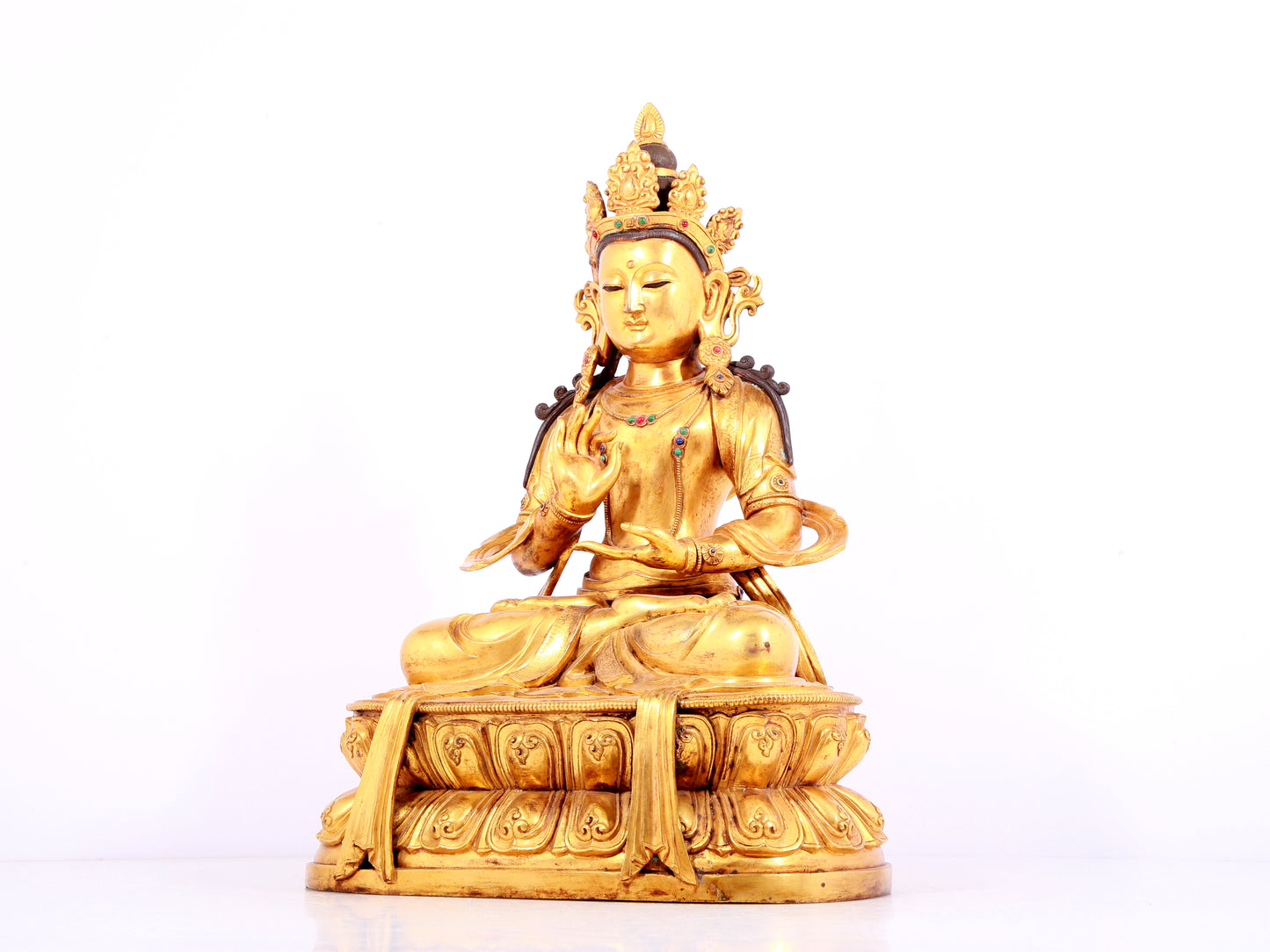 A solemn gilt bronze statue of Bodhisattva