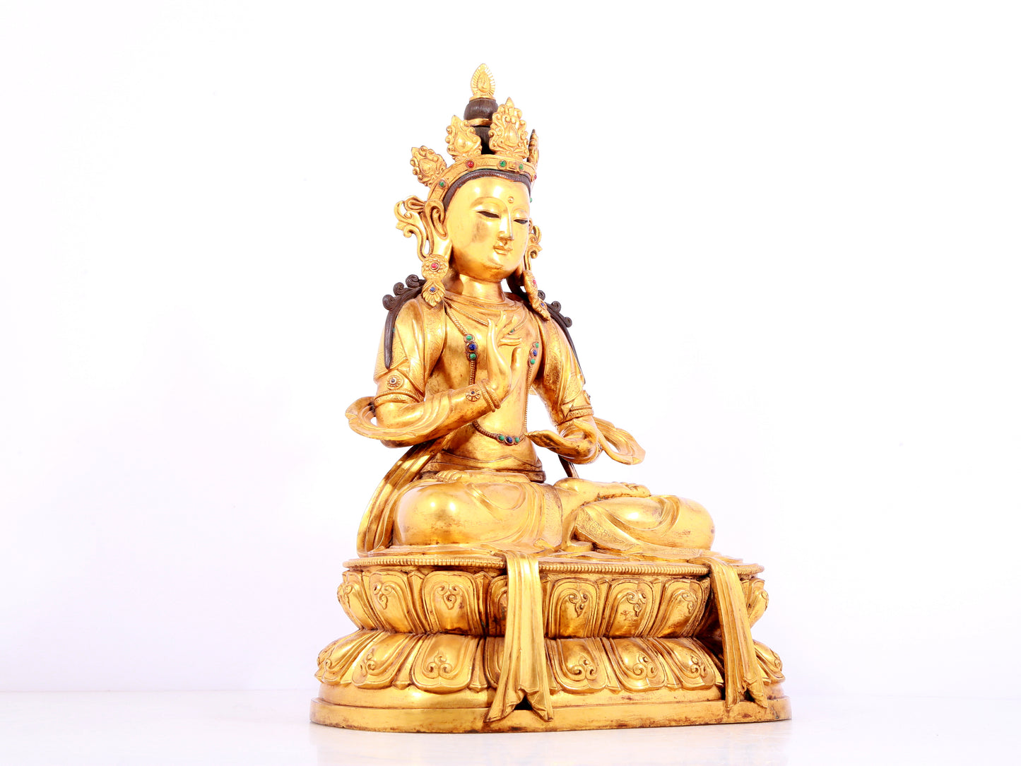 A solemn gilt bronze statue of Bodhisattva