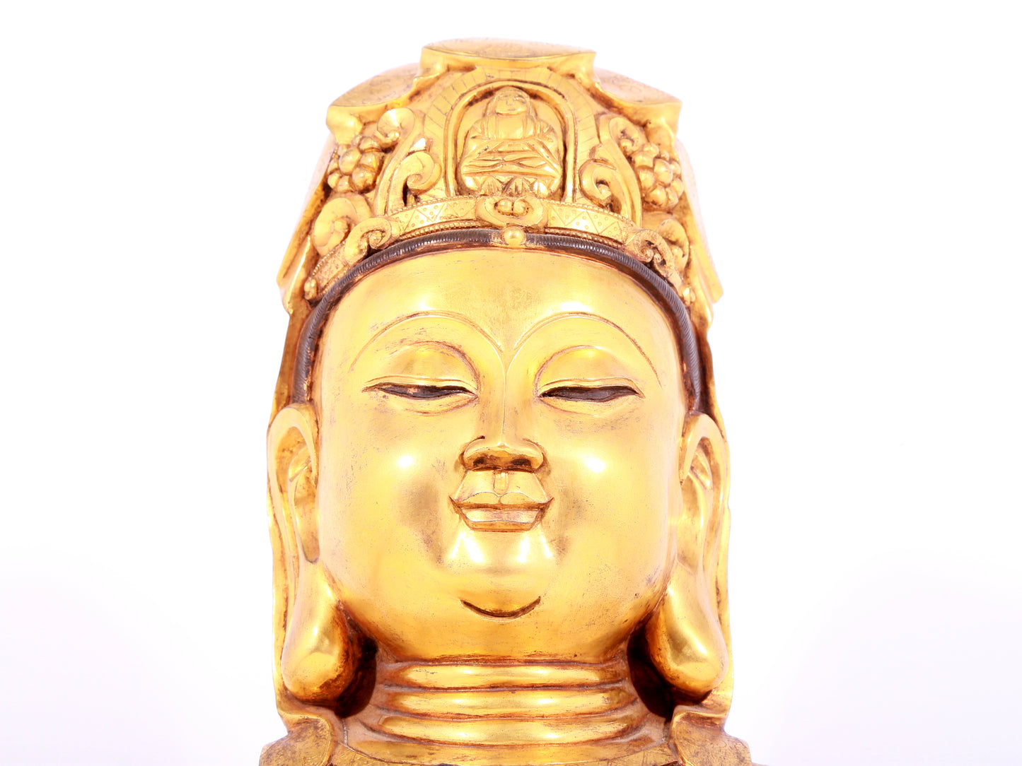 A solemn gilt bronze statue of Guanyin