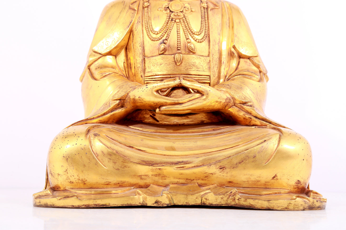 A solemn gilt bronze statue of Guanyin