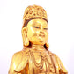 A solemn gilt bronze statue of Guanyin