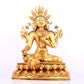 A solemn gilt bronze statue of green Tara