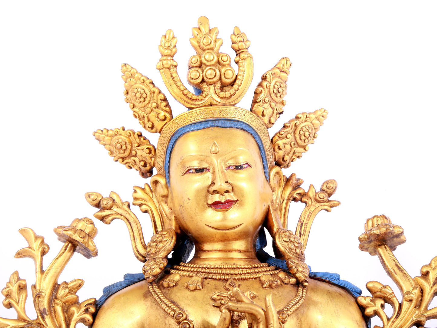 A solemn gilt bronze statue of green Tara