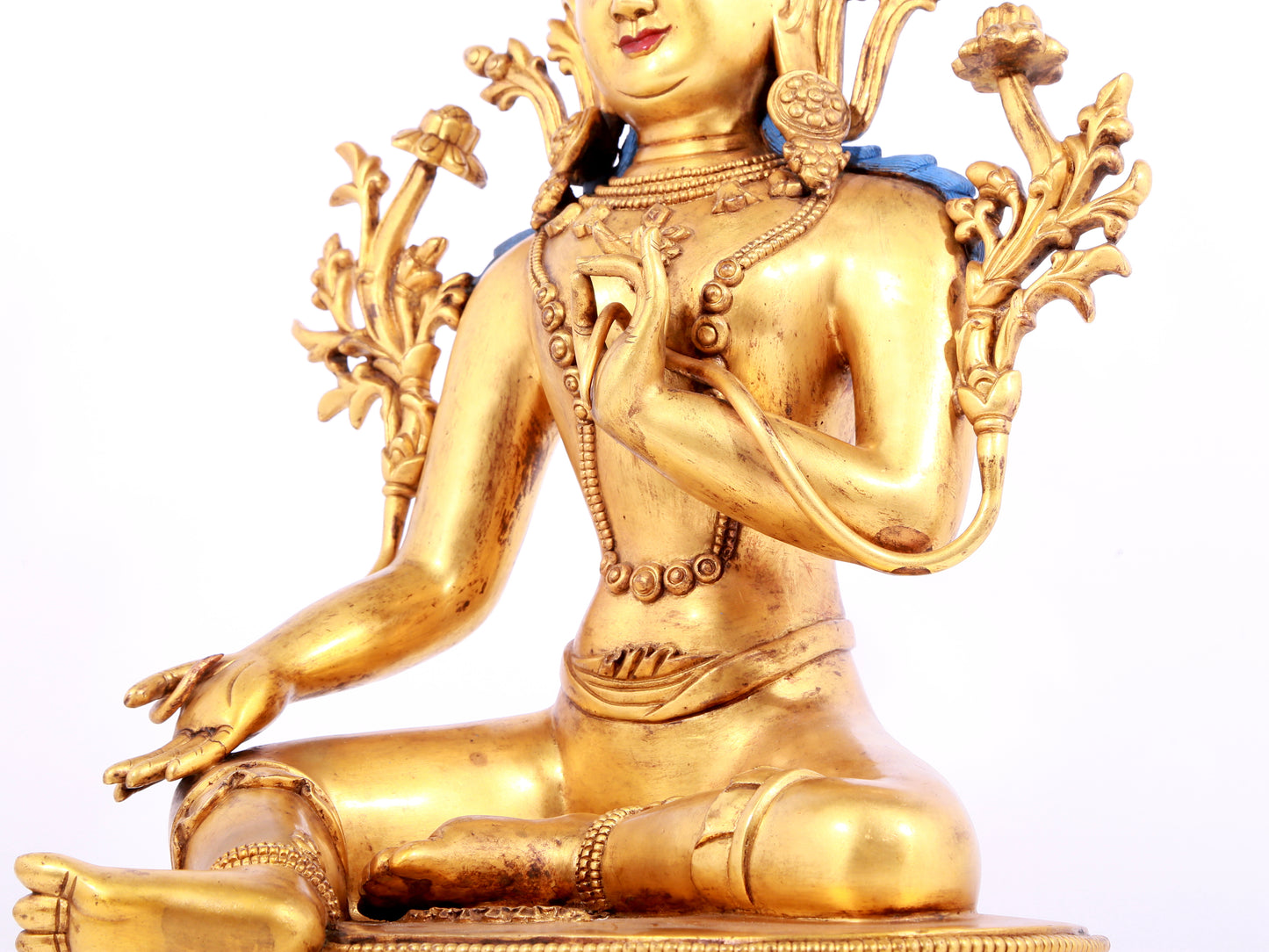 A solemn gilt bronze statue of green Tara