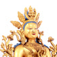 A solemn gilt bronze statue of green Tara