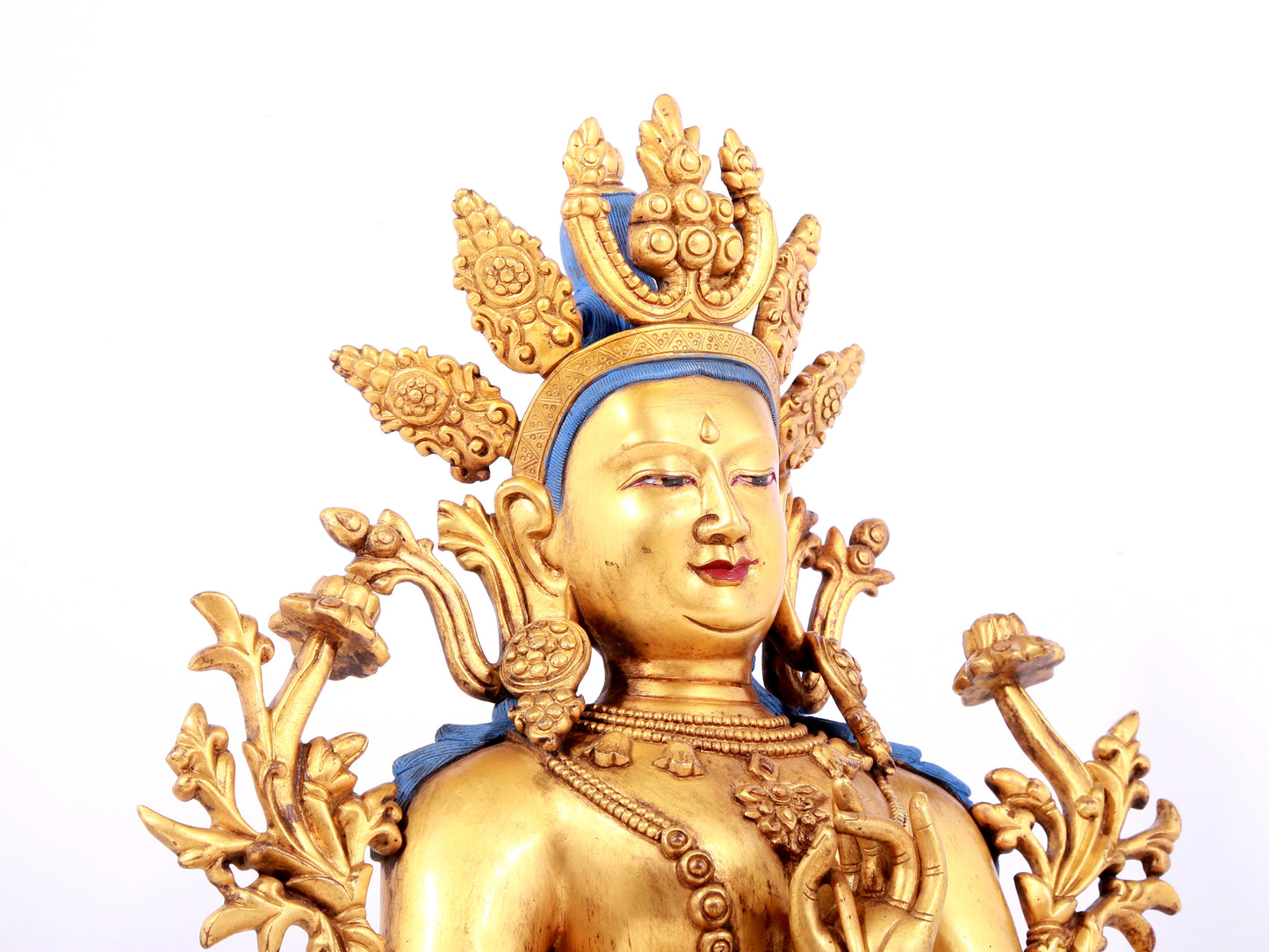 A solemn gilt bronze statue of green Tara