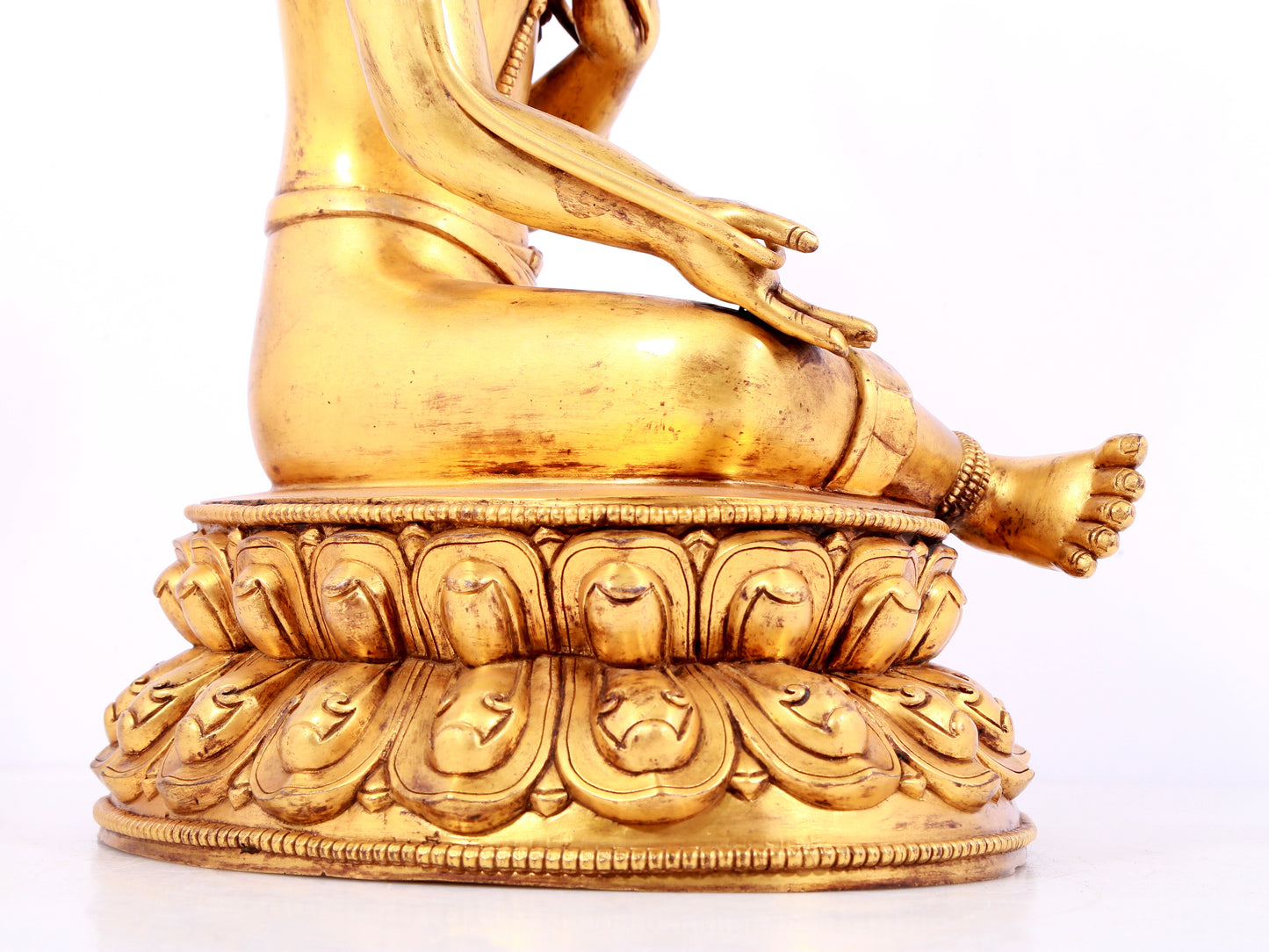 A solemn gilt bronze statue of green Tara