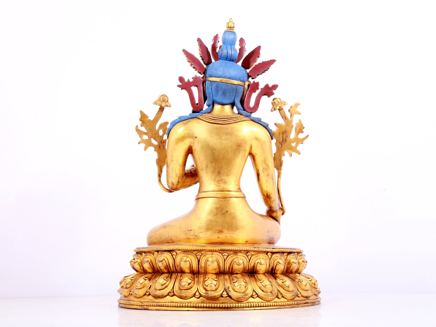 A solemn gilt bronze statue of green Tara