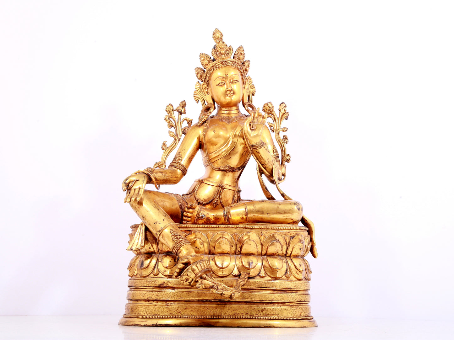 A solemn gilt bronze statue of green Tara