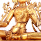 A solemn gilt bronze statue of green Tara