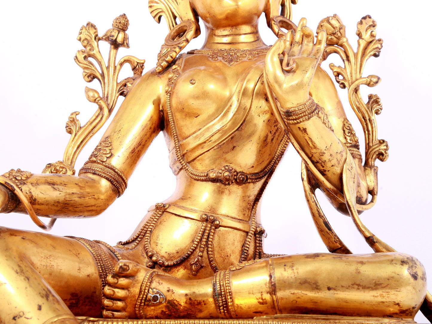 A solemn gilt bronze statue of green Tara