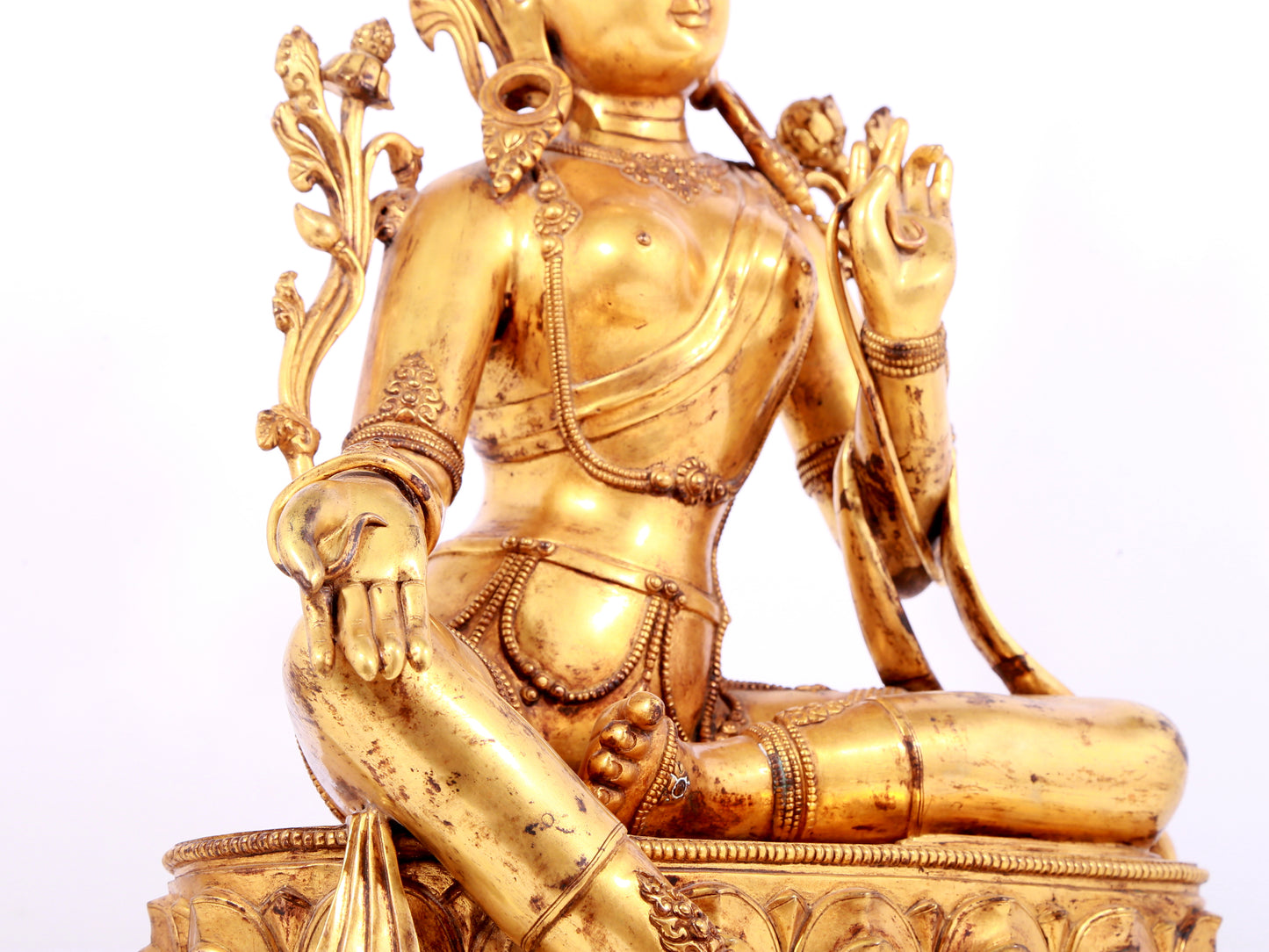 A solemn gilt bronze statue of green Tara