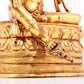 A solemn gilt bronze statue of green Tara