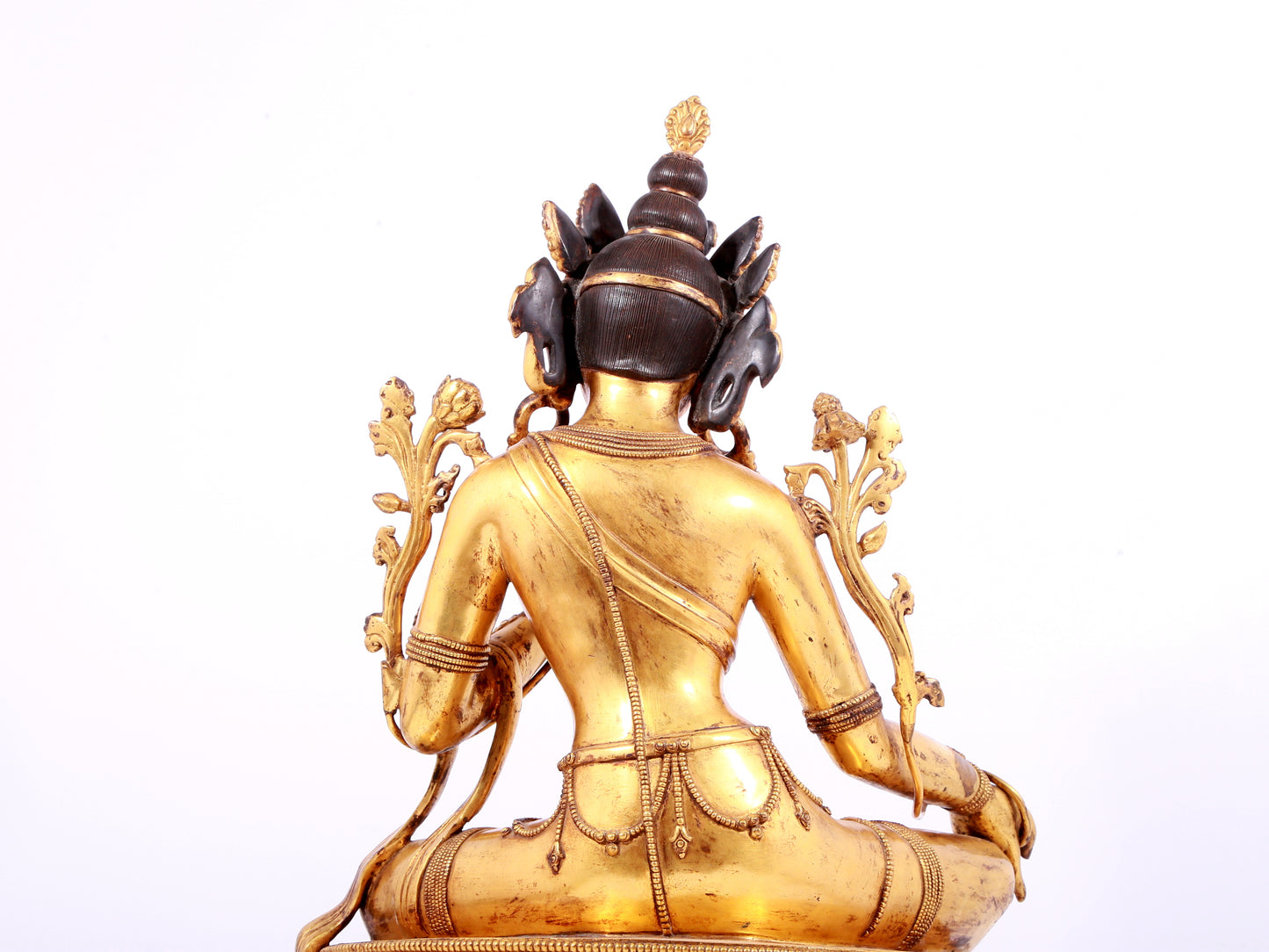 A solemn gilt bronze statue of green Tara