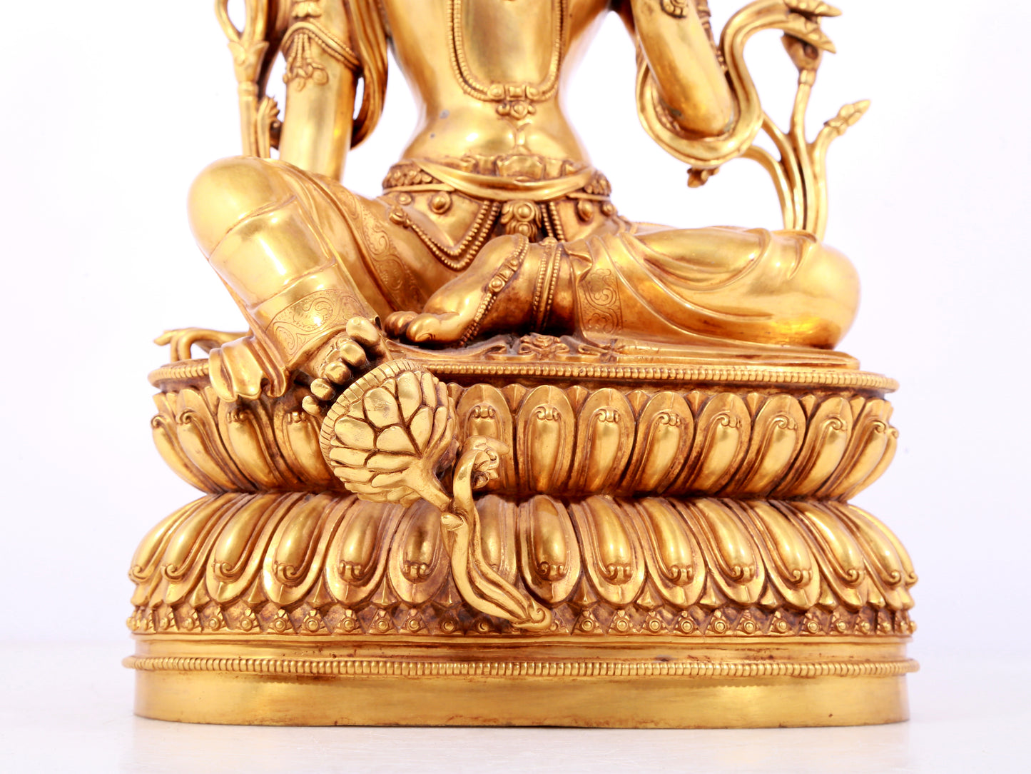 A solemn gilt copper green tara