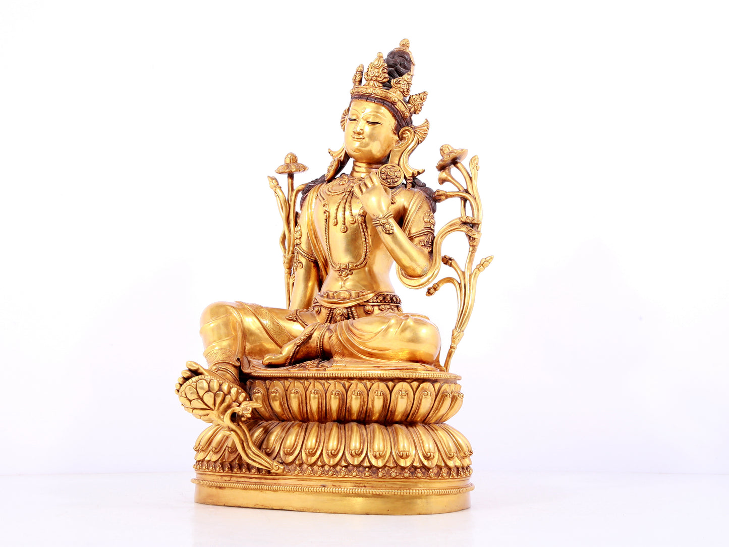 A solemn gilt copper green tara