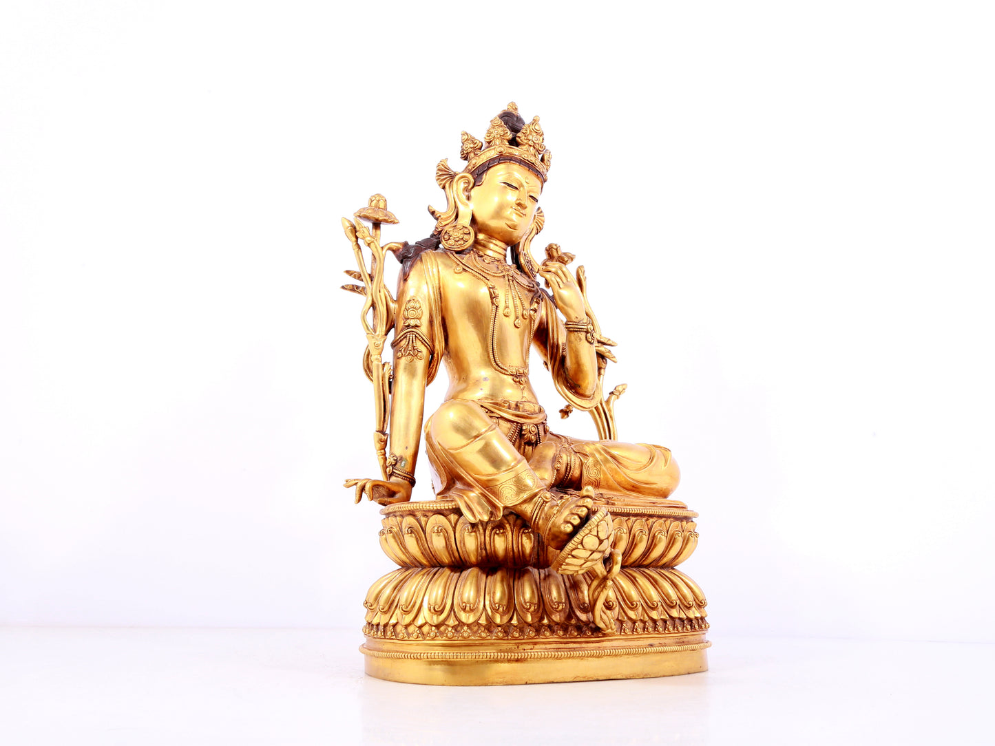 A solemn gilt copper green tara