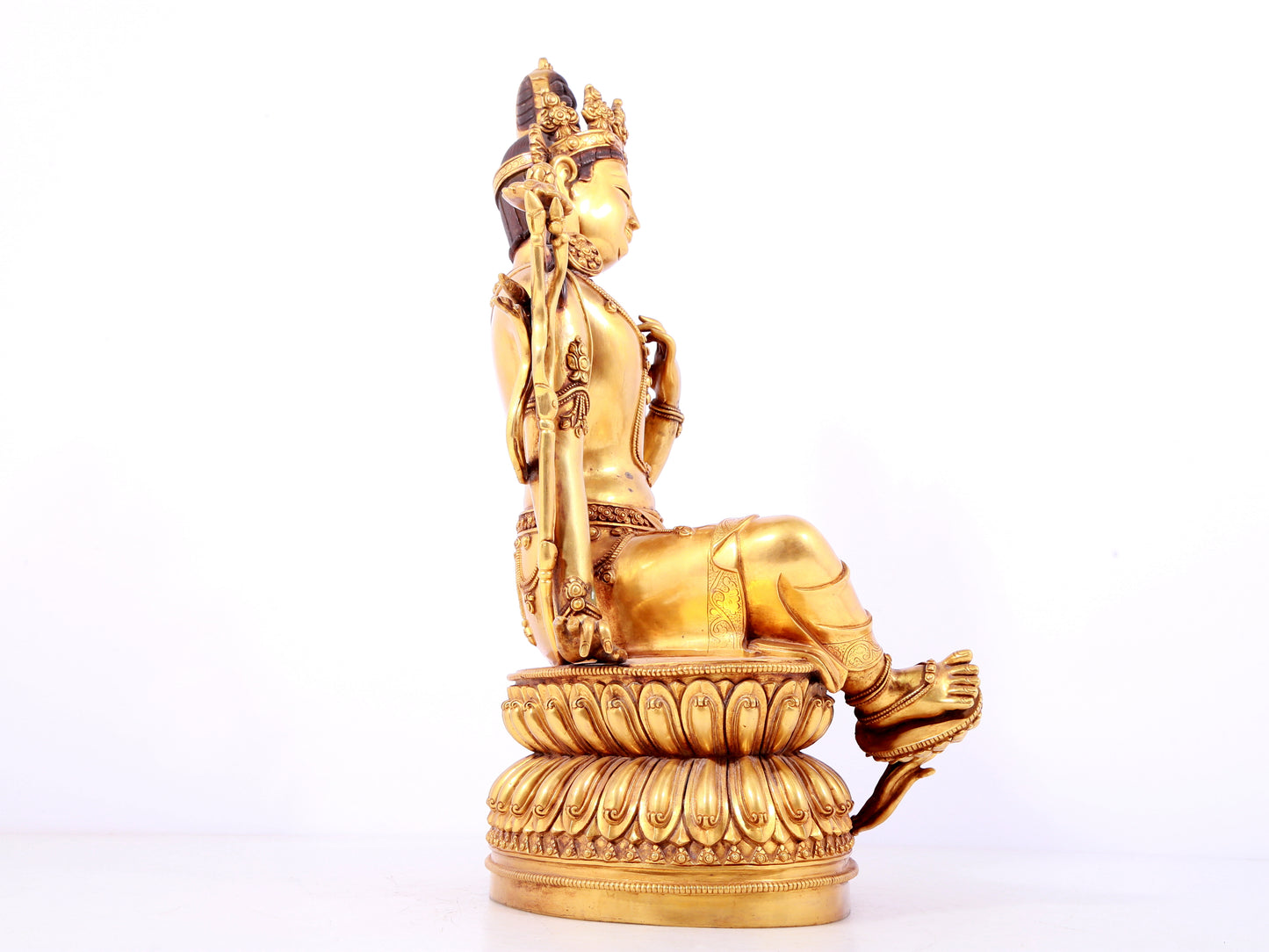 A solemn gilt copper green tara