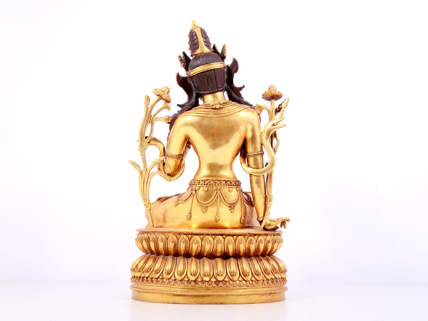 A solemn gilt copper green tara