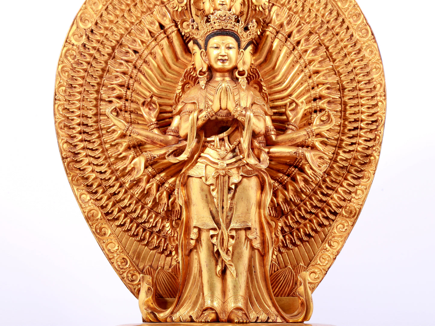 A solemn gilt bronze statue of Avalokitesvara with Thousand Arms