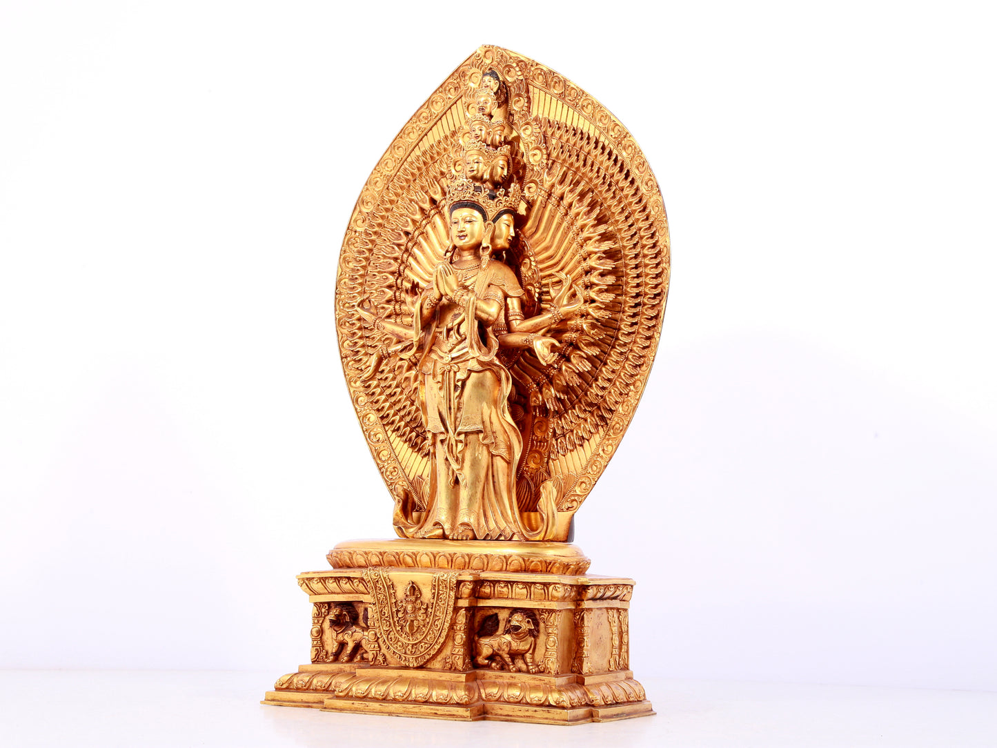 A solemn gilt bronze statue of Avalokitesvara with Thousand Arms