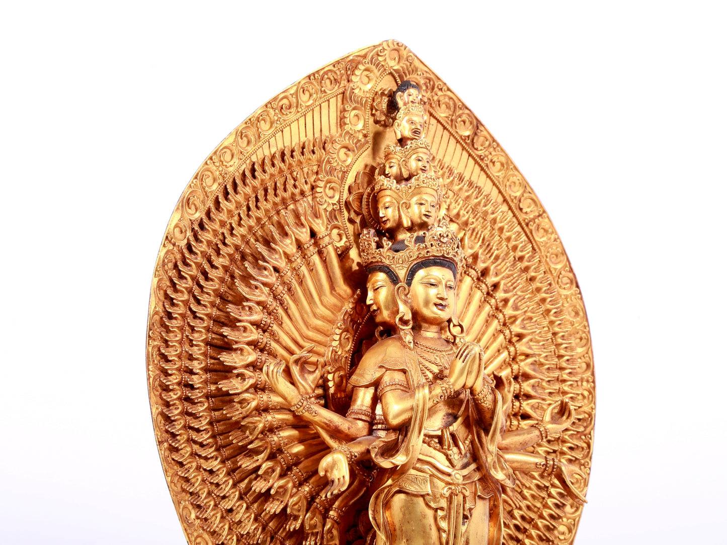 A solemn gilt bronze statue of Avalokitesvara with Thousand Arms