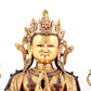 A solemn gilt bronze statue of Guanyin with four arms inlaid gems