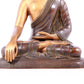 A solemn gilt bronze statue of Sakyamuni