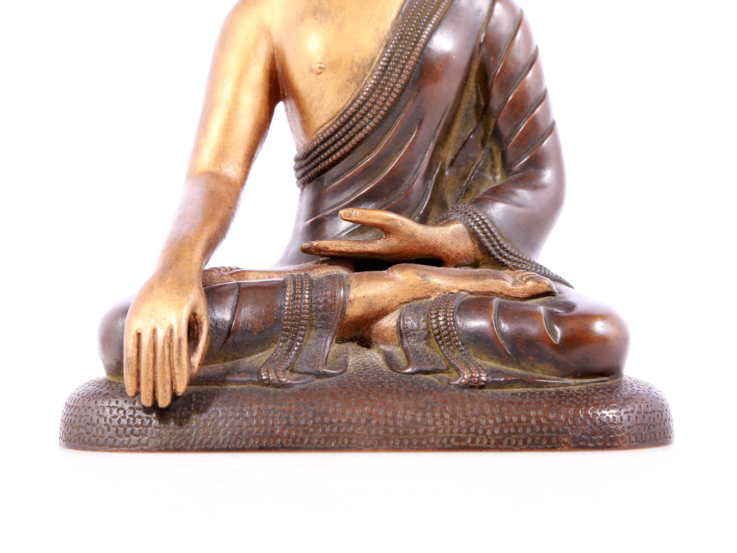 A solemn gilt bronze statue of Sakyamuni