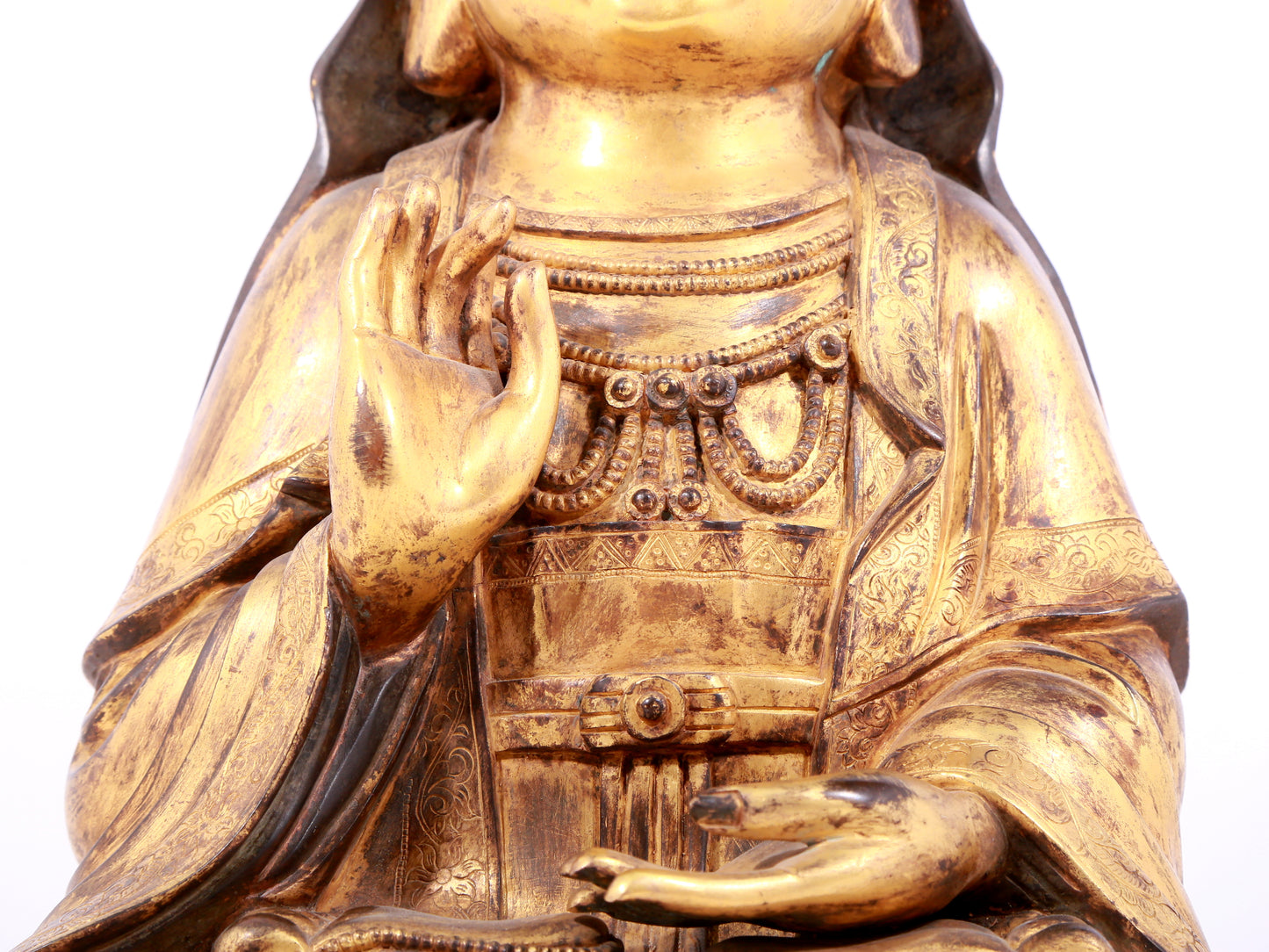 A solemn gilt bronze statue of Guanyin