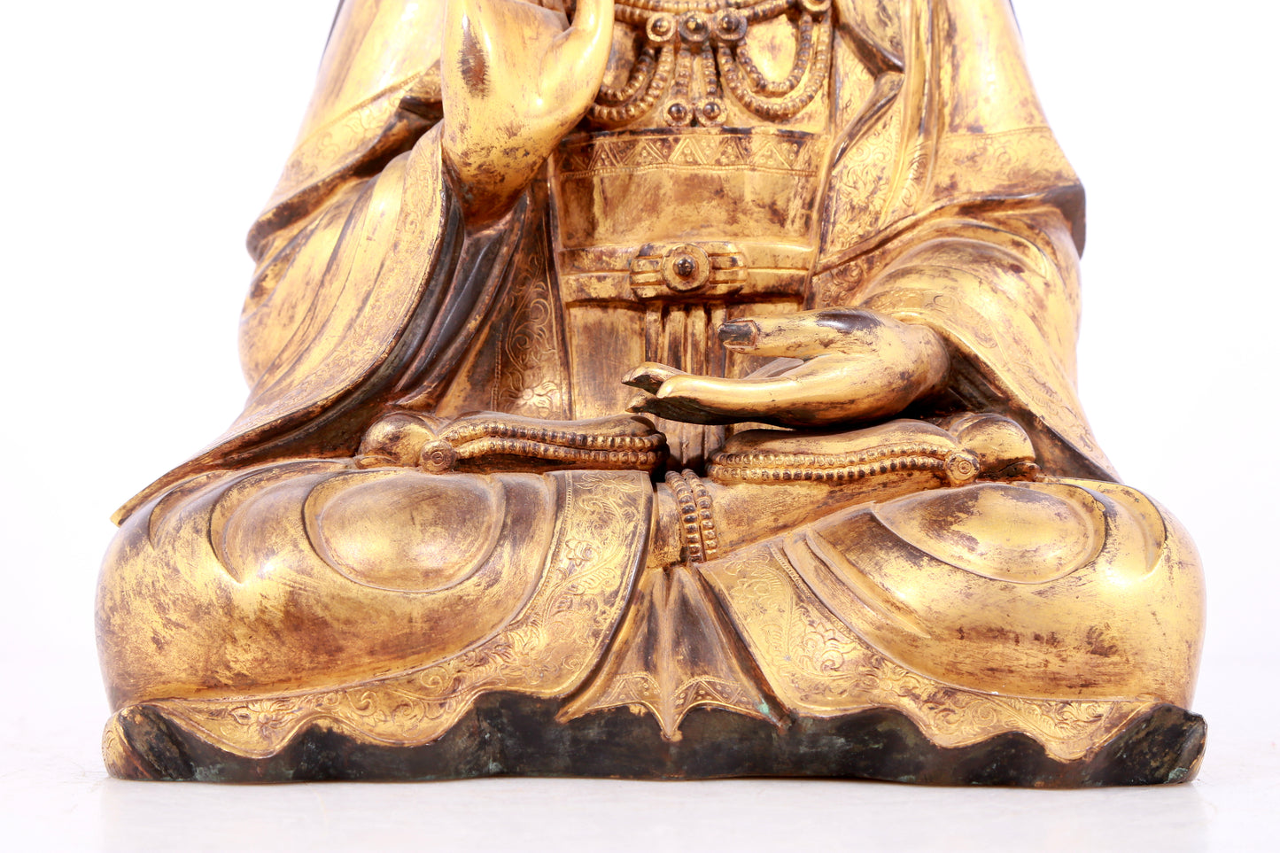 A solemn gilt bronze statue of Guanyin