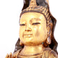 A solemn gilt bronze statue of Guanyin